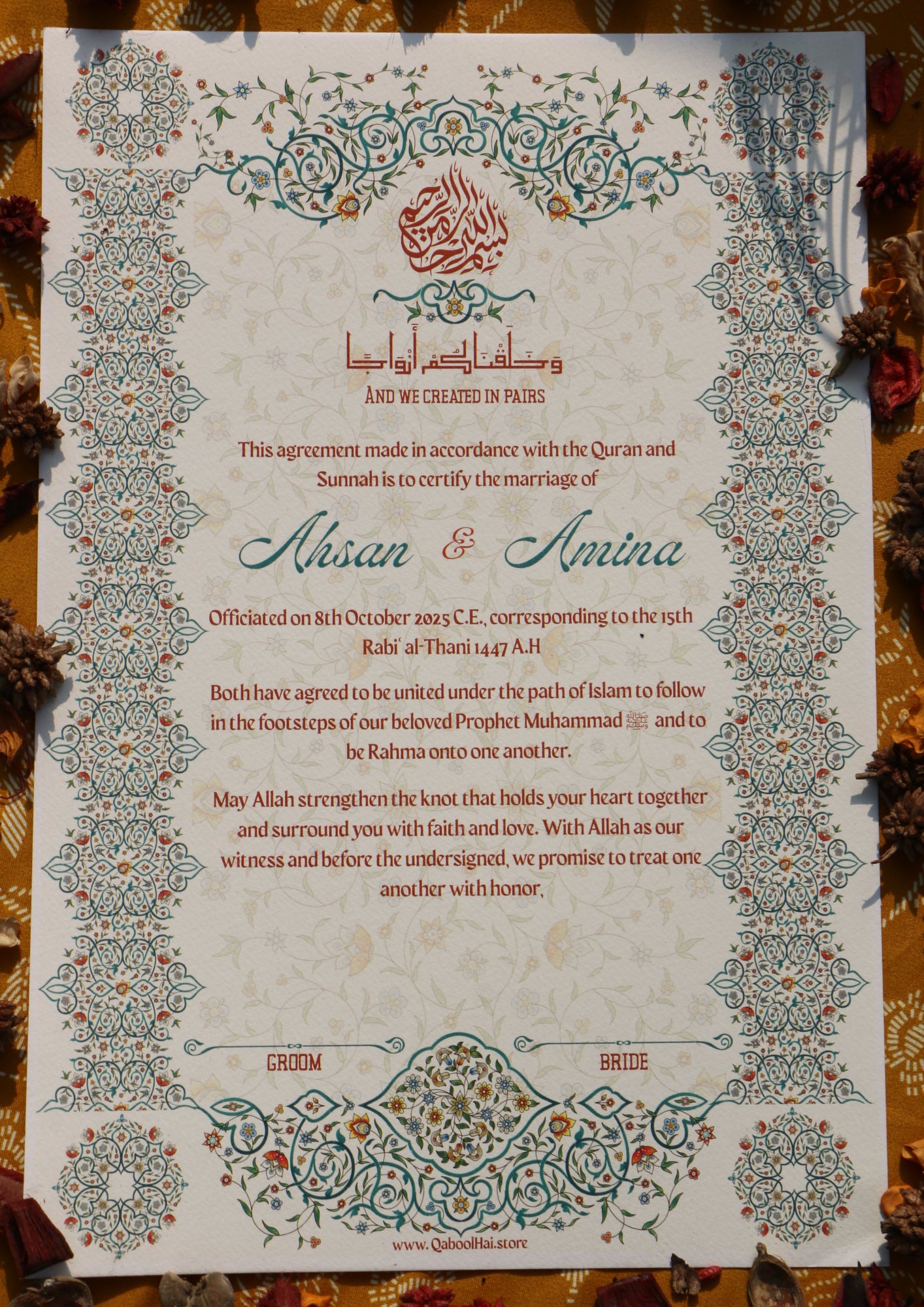 Decorative wedding invitation with intricate patterns on a textured surface.